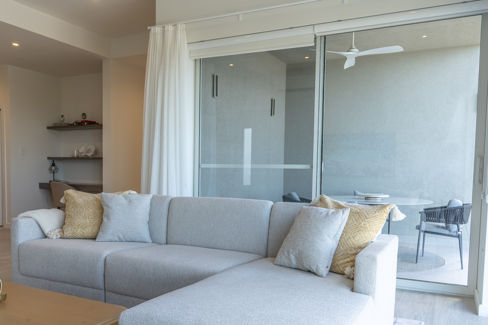 Open plan living room opening to terrace with sea views