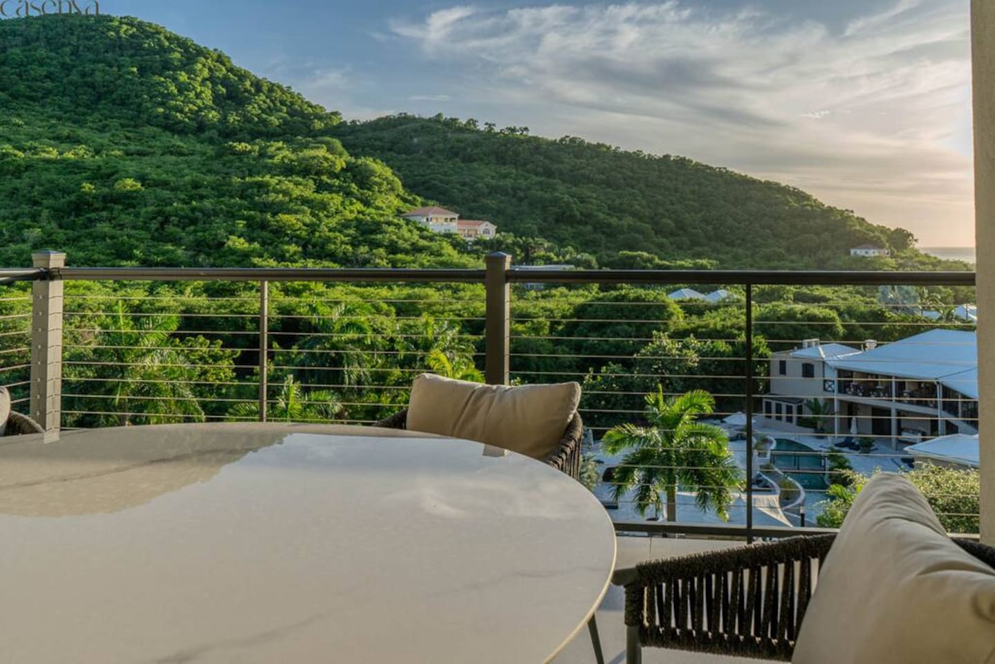 Patio terrace with outdoor dining and lush tropical views