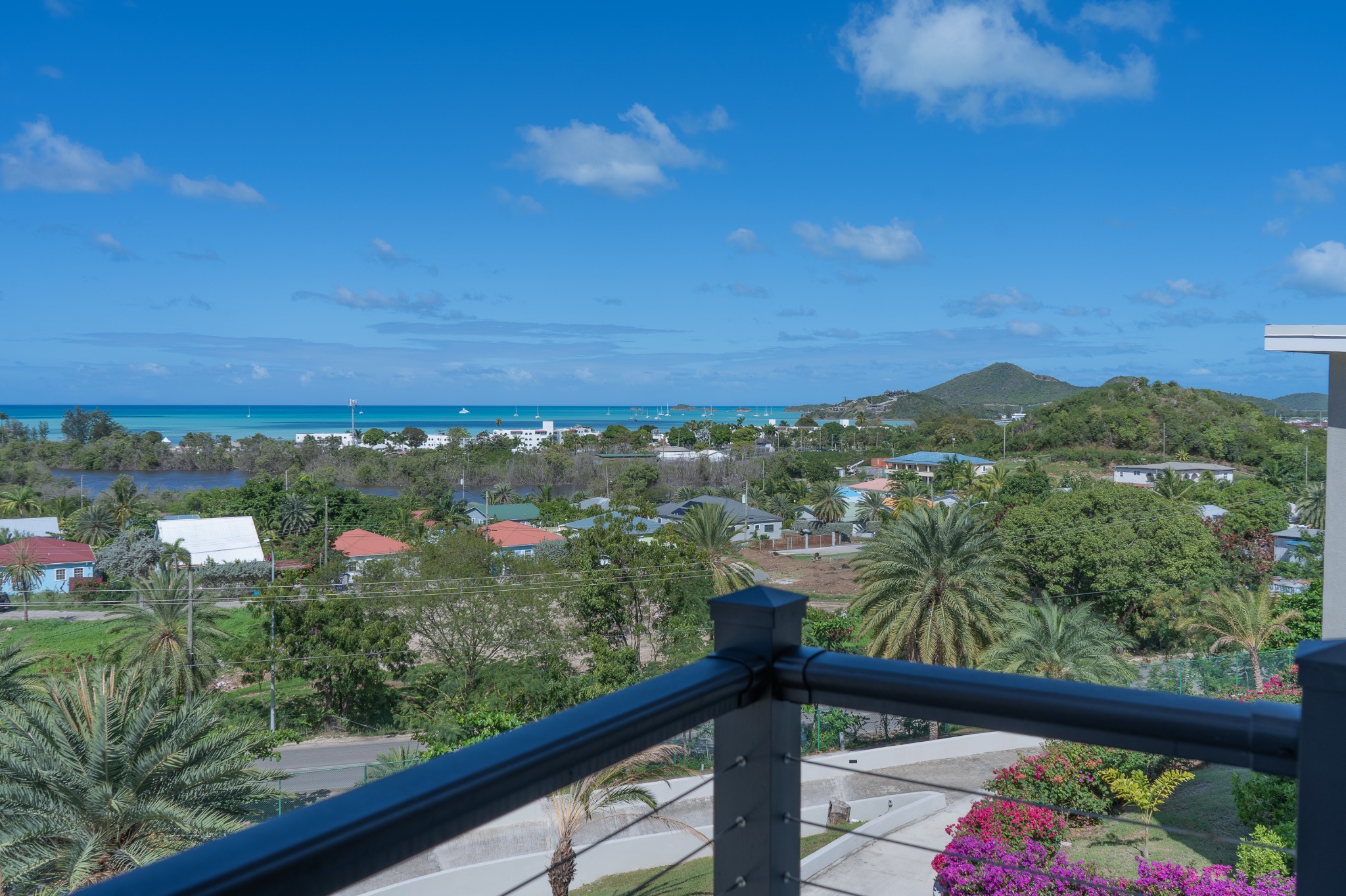 Private terrace with panoramic Caribbean sea and hill views